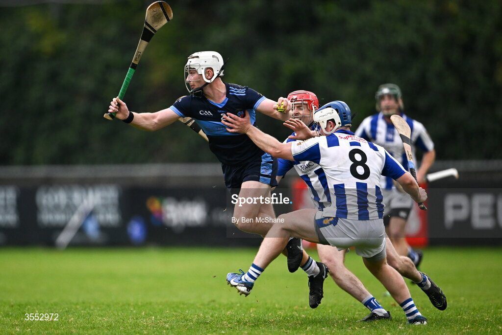 29 August 2026; Finbarr Wardick of St Jude's is tackled by Eoin Behan, 8, and Jonathan O'Driscoll of Ballyboden St Enda's during the PTSB Dublin Senior Club Hurling Championships Round 4 match between Ballyboden St Enda's and St Jude's at Parnell Park in Dublin. Photo by Ben McShane/Sportsfile