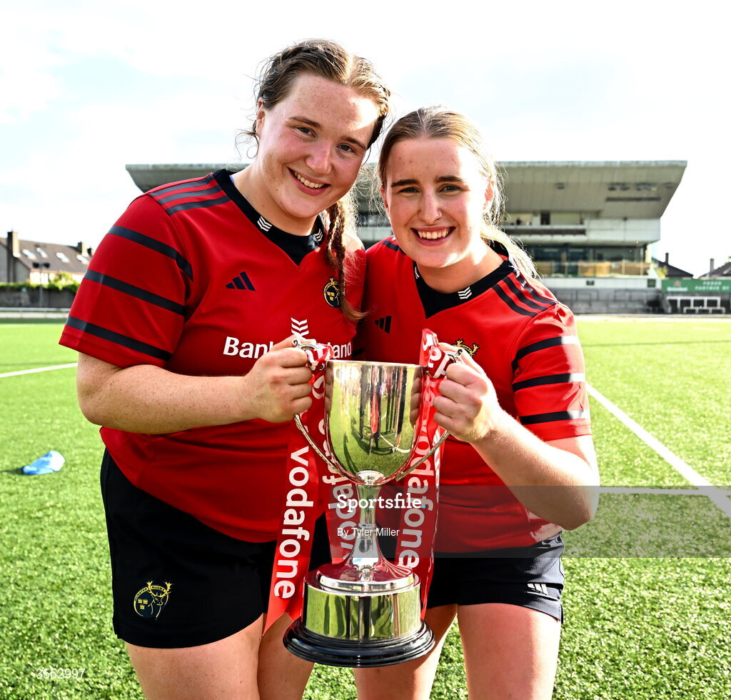 29 August 2026; Alisha Flynn, left, and Caoimhe Murphy of Munster celebrate with the trophy after the Vodafone Womens Interprovincial Championship final match between Munster and Leinster at Dexcom Stadium in Galway. Photo by Tyler Miller/Sportsfile