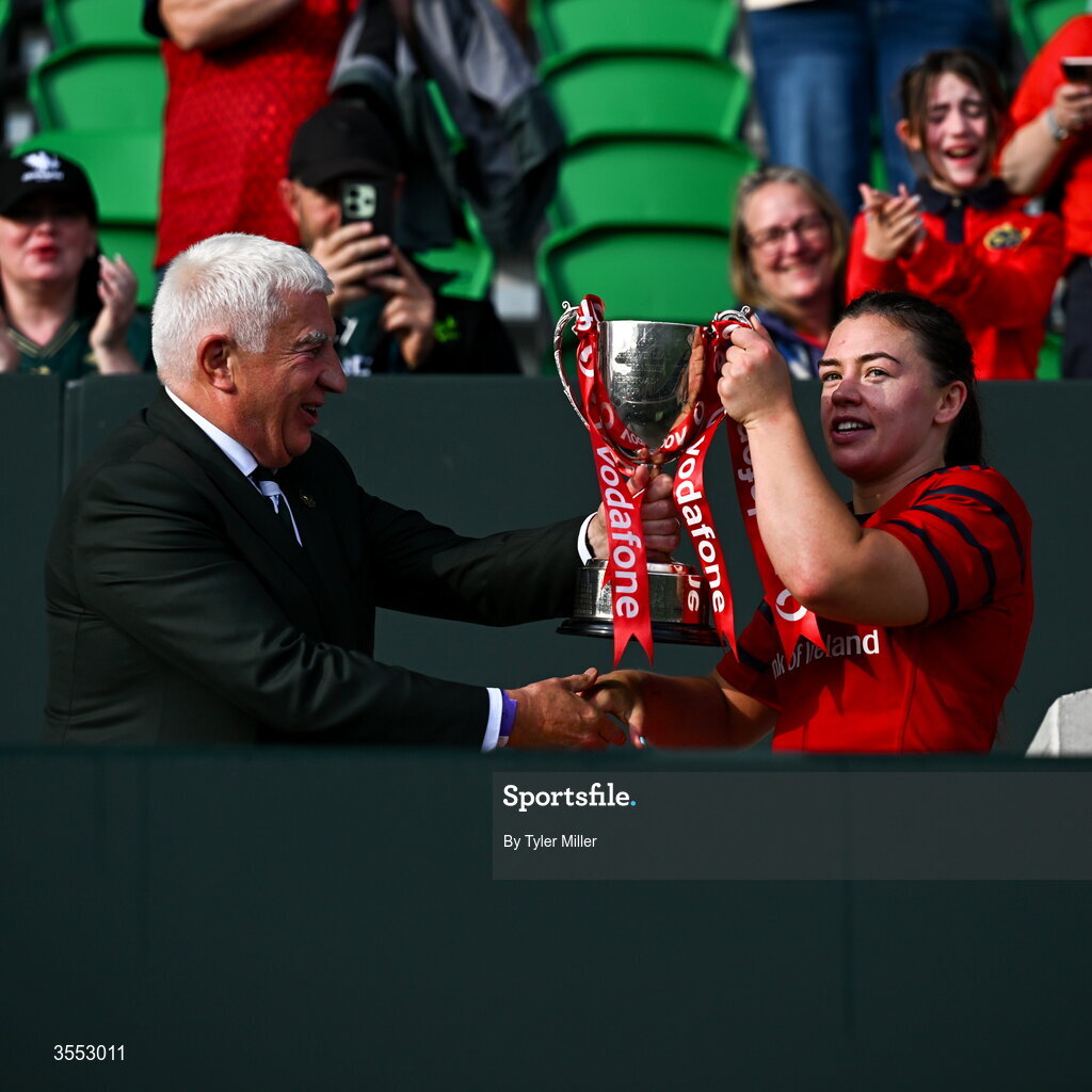 29 August 2026; IRFU President Tony O’Beirne presents the trophy to Maeve Óg O’Leary of Munster after the Vodafone Womens Interprovincial Championship final match between Munster and Leinster at Dexcom Stadium in Galway. Photo by Tyler Miller/Sportsfile