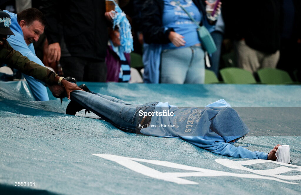29 August 2026; A supporter grabs a t-shirt fired by a t-shirt cannon during the 2026 Aer Lingus College Football Classic match between TCU and North Carolina at the Aviva Stadium in Dublin. Photo by Thomas Flinkow/Sportsfile