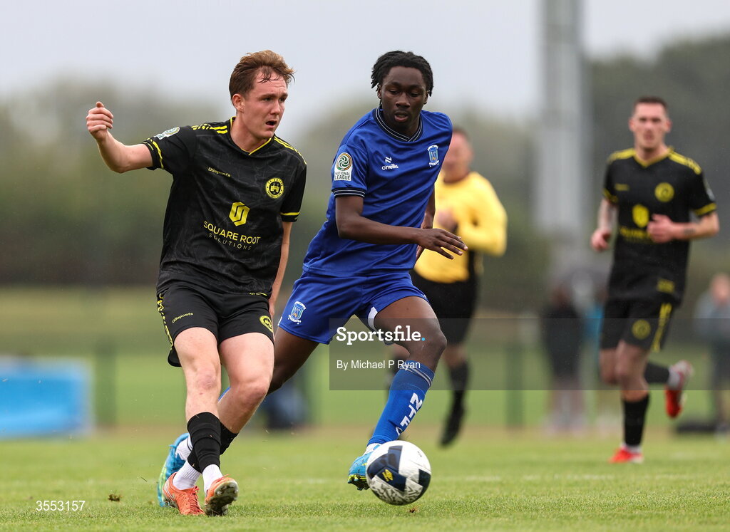 29 August 2026; Cian Carmody of CK United in action against Alex Akinrintoyo of Newbridge Town during the FAI National League Group 3 match between CK United and Newbridge Town at SETU Sports Complex in Carlow. Photo by Michael P Ryan/Sportsfile