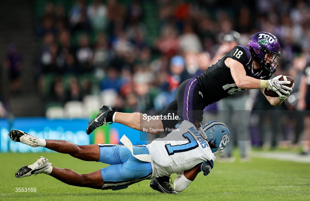 29 August 2026; TCU wide receiver Ed Small #18 is tackled by North Carolina defensive back Peyton Waters #7 during the 2026 Aer Lingus College Football Classic match between TCU and North Carolina at the Aviva Stadium in Dublin. Photo by Thomas Flinkow/Sportsfile