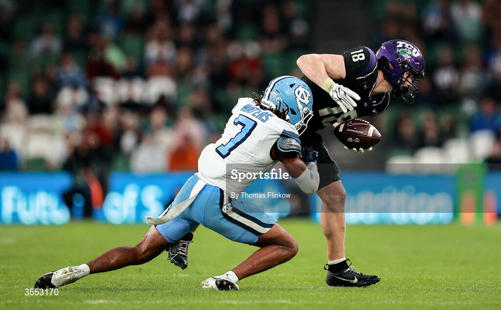 29 August 2026; TCU wide receiver Ed Small #18 is tackled by North Carolina defensive back Peyton Waters #7 during the 2026 Aer Lingus College Football Classic match between TCU and North Carolina at the Aviva Stadium in Dublin. Photo by Thomas Flinkow/Sportsfile
