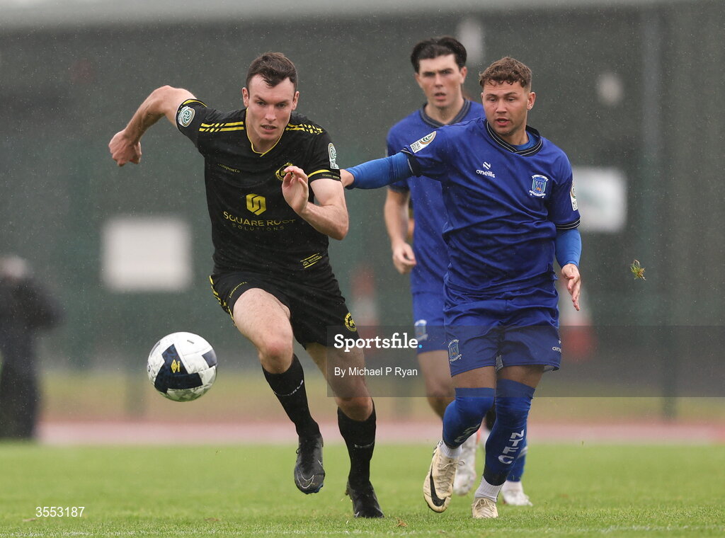 29 August 2026; Callum Warfield of CK United in action against Ethan Mills of Newbridge Town during the FAI National League Group 3 match between CK United and Newbridge Town at SETU Sports Complex in Carlow. Photo by Michael P Ryan/Sportsfile
