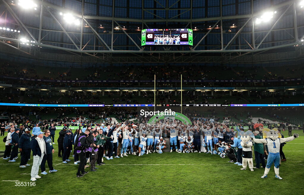 29 August 2026; North Carolina players celebrate with the trophy after their side's victory in the 2026 Aer Lingus College Football Classic match between TCU and North Carolina at the Aviva Stadium in Dublin. Photo by Thomas Flinkow/Sportsfile