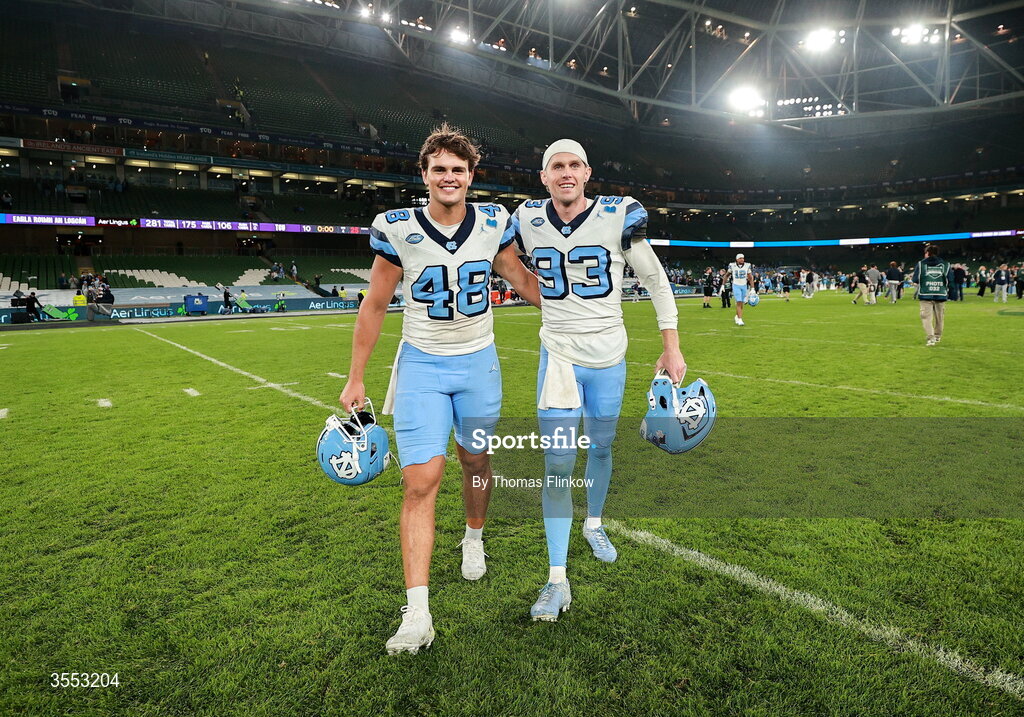 29 August 2026; North Carolina long snapper Gannon Burt #48 and North Carolina kicker Jacob Horvath #93 after their side's victory in the 2026 Aer Lingus College Football Classic match between TCU and North Carolina at the Aviva Stadium in Dublin. Photo by Thomas Flinkow/Sportsfile