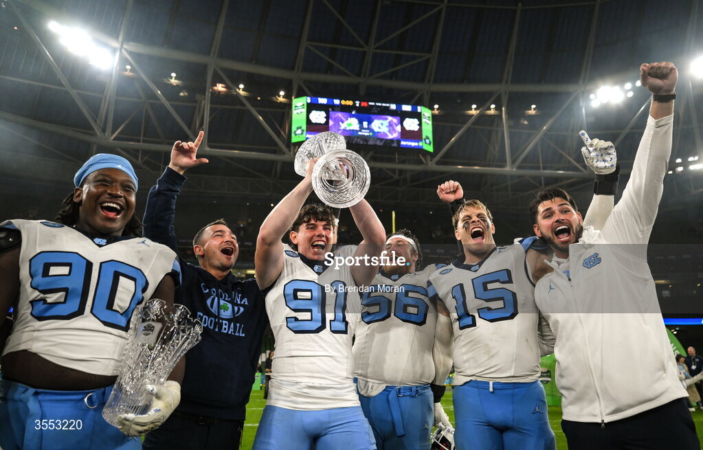 29 August 2026; North Carolina punter Adam McCann-Gibbs #91 and teammates celebrate with the trophy after his side's victory in the 2026 Aer Lingus College Football Classic match between TCU and North Carolina at the Aviva Stadium in Dublin. Photo by Brendan Moran/Sportsfile