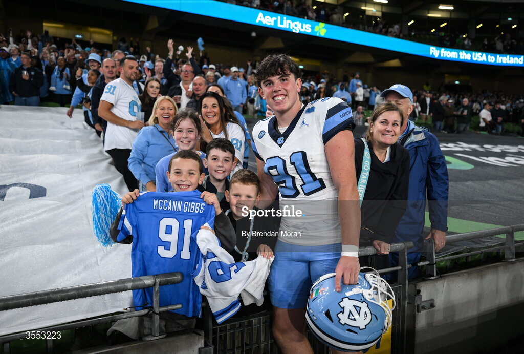 29 August 2026; North Carolina punter Adam McCann-Gibbs #91 celebrates with his family after his side's victory in the 2026 Aer Lingus College Football Classic match between TCU and North Carolina at the Aviva Stadium in Dublin. Photo by Brendan Moran/Sportsfile