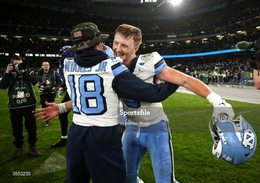 29 August 2026; North Carolina quarterback Billy Edwards Jr #9 celebrates with North Carolina quarterback Andres Miyares Jr #18 after his side's victory in the 2026 Aer Lingus College Football Classic match between TCU and North Carolina at the Aviva Stadium in Dublin. Photo by Brendan Moran/Sportsfile