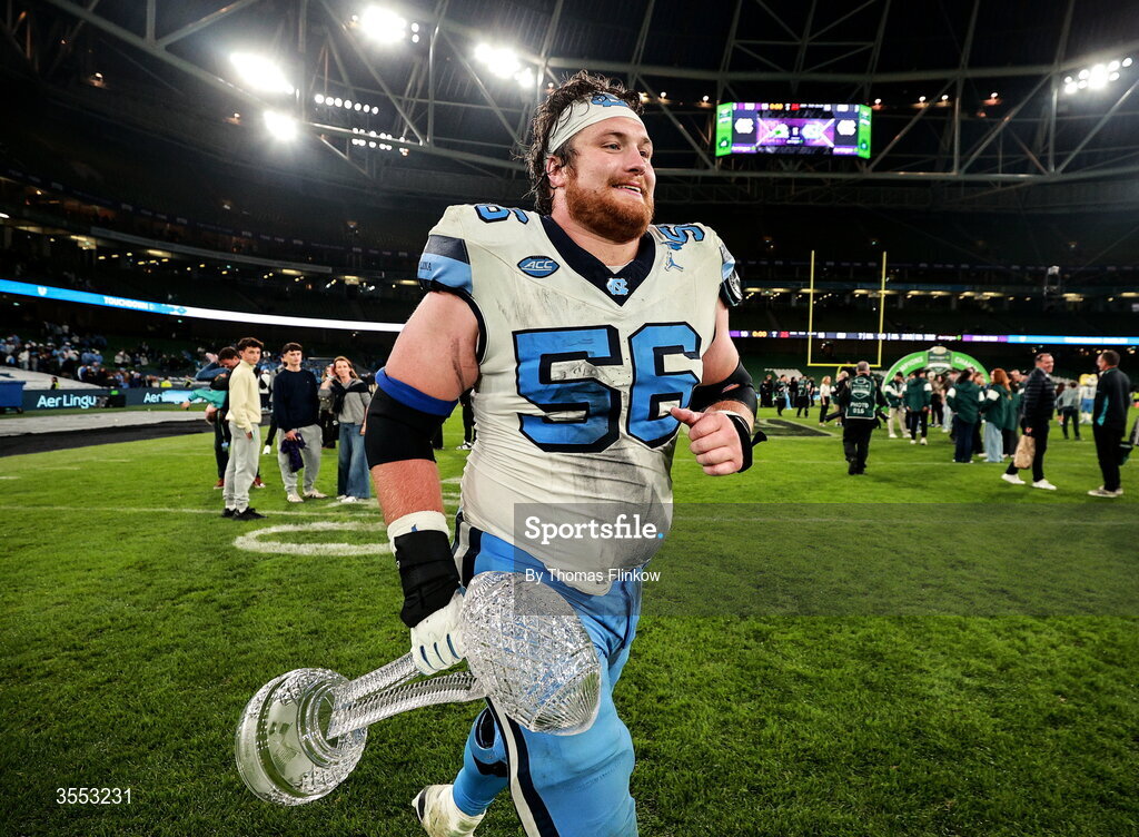 29 August 2026; North Carolina offensive lineman Christo Kelly #56 with the trophy after the 2026 Aer Lingus College Football Classic match between TCU and North Carolina at the Aviva Stadium in Dublin. Photo by Thomas Flinkow/Sportsfile