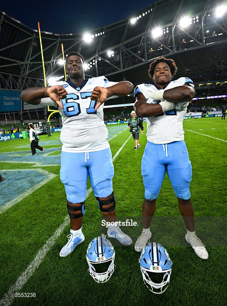 29 August 2026; North Carolina offensive lineman Dujuan Davis #67 and North Carolina defensive lineman Jaylen Harvey #11 celebrate after their side's victory in the 2026 Aer Lingus College Football Classic match between TCU and North Carolina at the Aviva Stadium in Dublin. Photo by Seb Daly/Sportsfile
