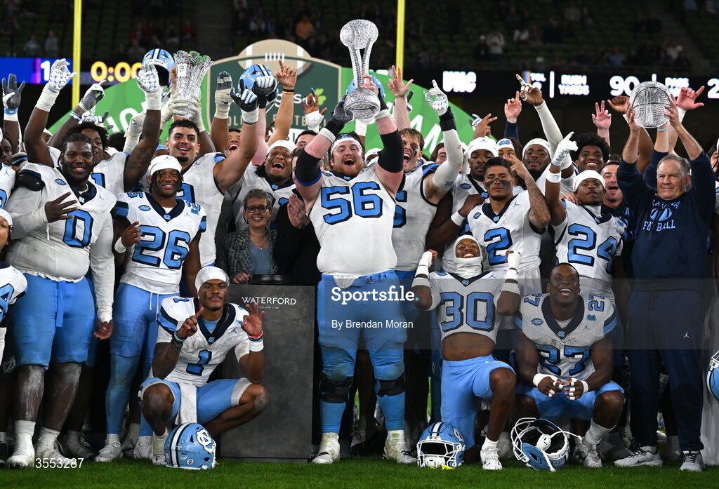 29 August 2026; North Carolina offensive lineman Christo Kelly #56, North Carolina Head Coach Bill Belichick, and teammates celebrate at the 2026 Aer Lingus College Football Classic match between TCU and North Carolina at the Aviva Stadium in Dublin. Photo by Brendan Moran/Sportsfile