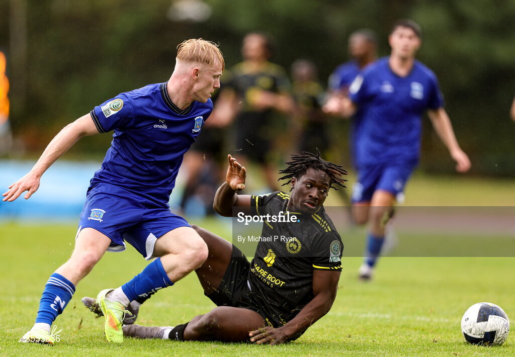 29 August 2026; Oluwafayosayemi Adeogun of CK United in action against Finn Cowper Gray of Newbridge Town during the FAI National League Group 3 match between CK United and Newbridge Town at SETU Sports Complex in Carlow. Photo by Michael P Ryan/Sportsfile