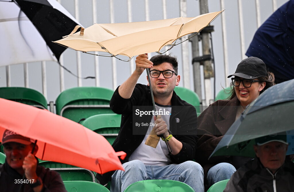 30 August 2026; A spectator struggles with his umbrella during day four of the 2026 KPMG Women’s Irish Open Golf Championship at The K Club in Straffan, Kildare. Photo by Seb Daly/Sportsfile