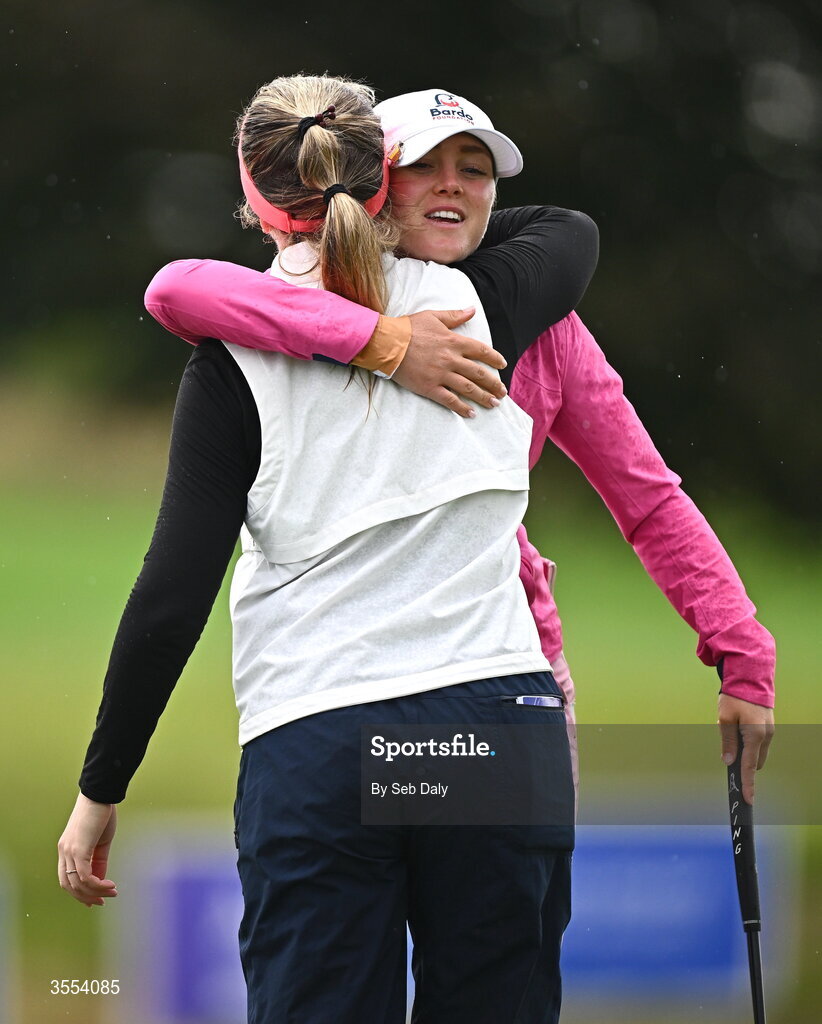 30 August 2026; Dorthea Forbrigd of Norway and Noora Komulainen of Finland embrace after finishing their round on the 18th green during day four of the 2026 KPMG Women’s Irish Open Golf Championship at The K Club in Straffan, Kildare. Photo by Seb Daly/Sportsfile