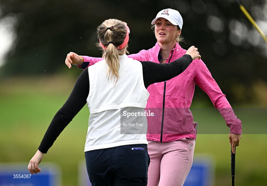 30 August 2026; Dorthea Forbrigd of Norway and Noora Komulainen of Finland embrace after finishing their round on the 18th green during day four of the 2026 KPMG Women’s Irish Open Golf Championship at The K Club in Straffan, Kildare. Photo by Seb Daly/Sportsfile