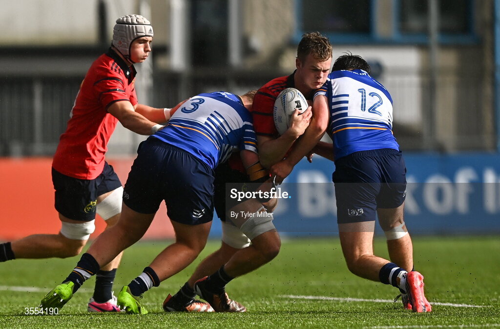 30 August 2026; Ben O'Connell of Munster in action against Tadhg Halpenny, left, and Tom Martin of Leinster during the PwC U19 InterProvincial Championship match between Leinster and Munster at Energia Park in Dublin. Photo by Tyler Miller/Sportsfile