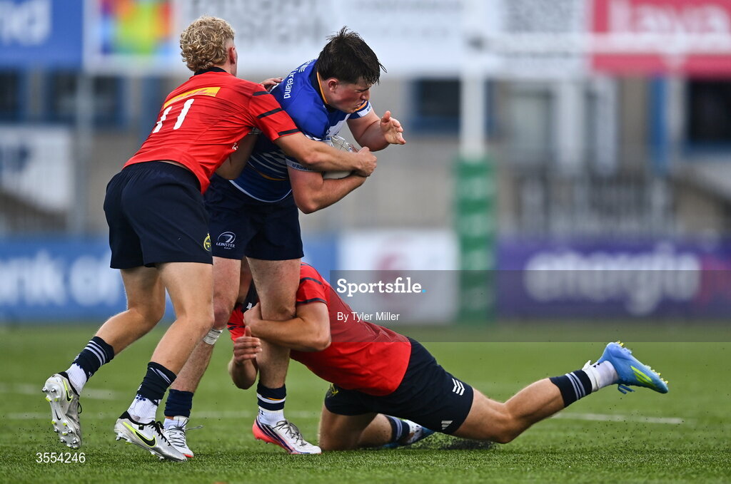 30 August 2026; Tom Martin of Leinster in action against Cillian O'Flynn, left, and Cathal O'Mara of Munster during the PwC U19 InterProvincial Championship match between Leinster and Munster at Energia Park in Dublin. Photo by Tyler Miller/Sportsfile