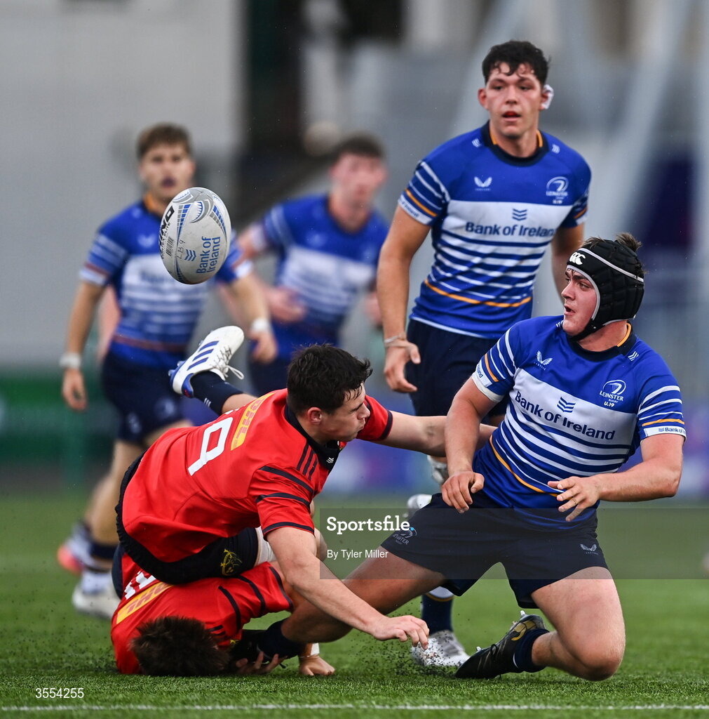 30 August 2026; Eoghan Brady of Leinster in action against Alex Ryan, top, and Liam O'Brien of Munster during the PwC U19 InterProvincial Championship match between Leinster and Munster at Energia Park in Dublin. Photo by Tyler Miller/Sportsfile