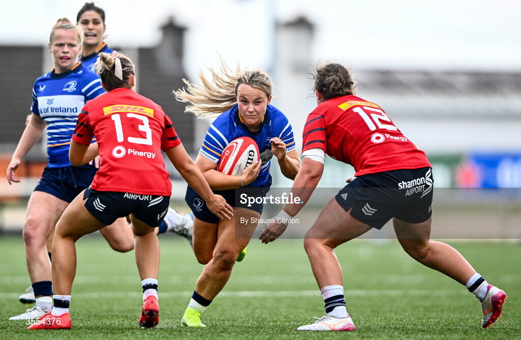 29 August 2026; Aoife Dalton of Leinster is tackled by Munster players Lucia Linn, left, and Enya Breen during the Vodafone Womens Interprovincial Championship final match between Munster and Leinster at Dexcom Stadium in Galway. Photo by Shauna Clinton/Sportsfile