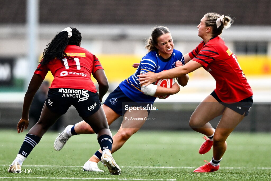 29 August 2026; Robyn O'Connor of Leinster in action against Munster players Chisom Ugwueru, left, and Lucia Linn/ during the Vodafone Womens Interprovincial Championship final match between Munster and Leinster at Dexcom Stadium in Galway. Photo by Shauna Clinton/Sportsfile