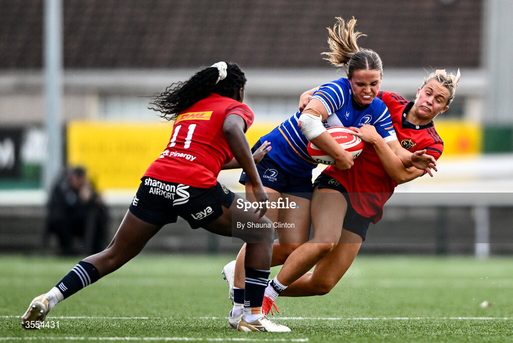 29 August 2026; Robyn O'Connor of Leinster in action against Munster players Chisom Ugwueru, left, and Lucia Linn/ during the Vodafone Womens Interprovincial Championship final match between Munster and Leinster at Dexcom Stadium in Galway. Photo by Shauna Clinton/Sportsfile