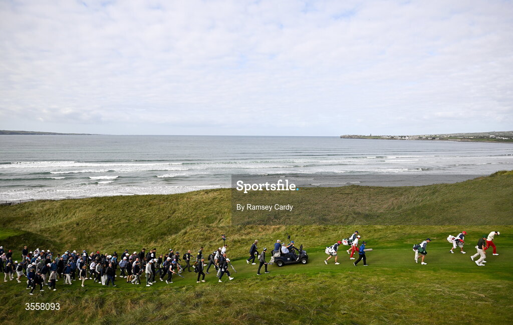 5 September 2026; Crowds follow the pairing of Connor Graham and Tyler Weaver of Great Britain and Ireland against Jay Leng Jr and Kihei Akina of USA during the foursomes matches on day one of the 51st Walker Cup at Lahinch Golf Club in Lahinch, Clare. Photo by Ramsey Cardy/Sportsfile