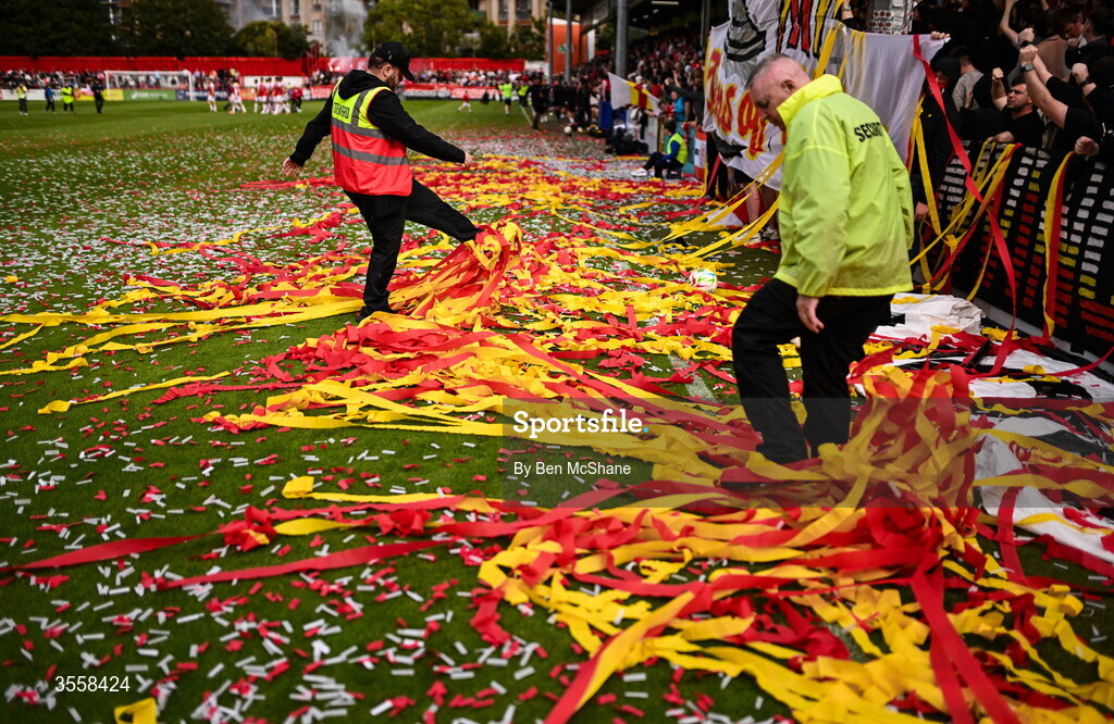 5 September 2026; Security and steward clear the tape and confetti from the pitch from the St Patrick's Athletic supporters display before the Club Orange Men’s FAI Cup quarter-final match between St Patrick's Athletic and Bohemians at Richmond Park in Dublin. Photo by Ben McShane/Sportsfile