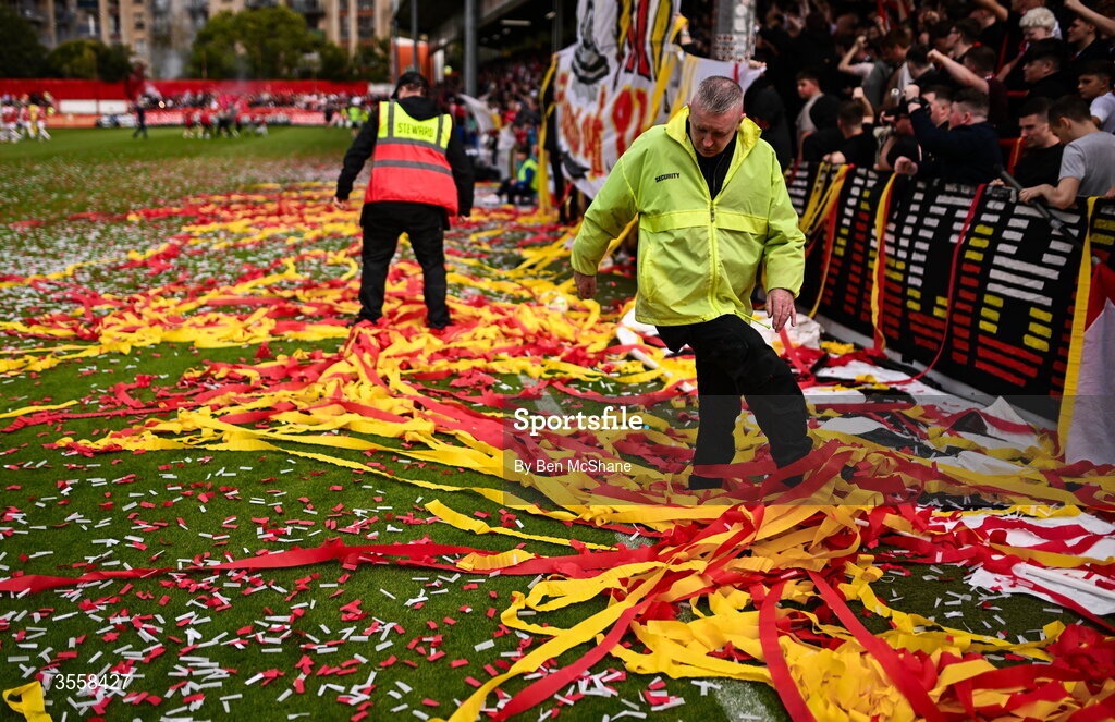 5 September 2026; Security and steward clear the tape and confetti from the pitch from the St Patrick's Athletic supporters display before the Club Orange Men’s FAI Cup quarter-final match between St Patrick's Athletic and Bohemians at Richmond Park in Dublin. Photo by Ben McShane/Sportsfile