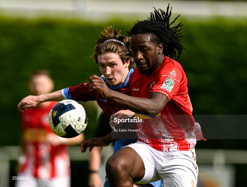 5 September 2026; Kobichidi Ndebumadu of Lucan United in action against Luke O'Gorman of Mervue United during the FAI National League match between Lucan United and Mervue United at Copper Face Jacks Park in Dublin. Photo by Eakin Howard/Sportsfile