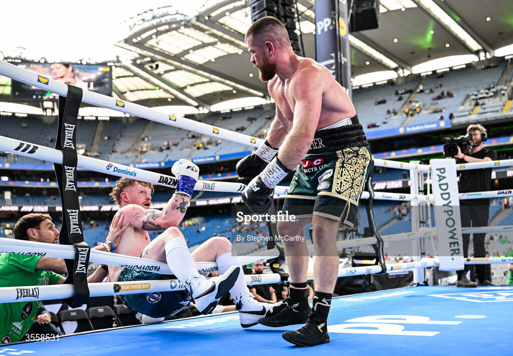5 September 2026; Paul Ryan, left, is knocked down by Paddy Gallagher during their middleweight bout at the Once Upon A Time fight night in Croke Park, Dublin. Photo by Stephen McCarthy/Sportsfile