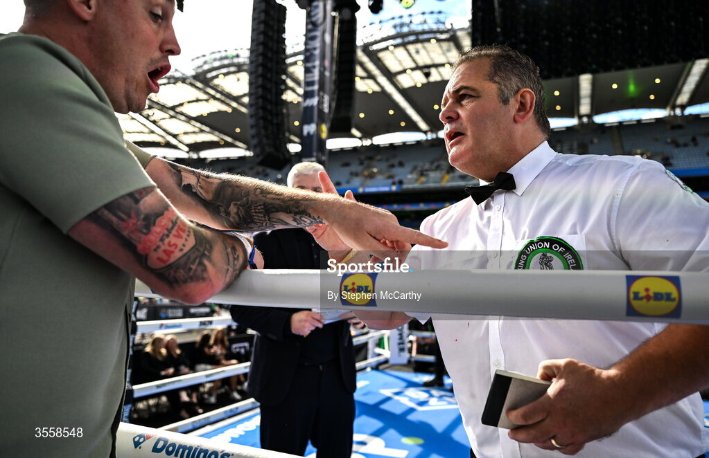 5 September 2026; The referee speaks with a member of Paul Ryan's corner after his defeat in his middleweight bout with Paddy Gallagher at the Once Upon A Time fight night in Croke Park, Dublin. Photo by Stephen McCarthy/Sportsfile
