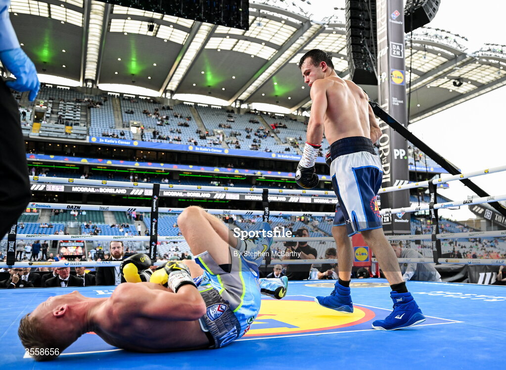 5 September 2026; Joe McGrail, right, after knocking down Matthew Boreland during their WBA continental gold super bantamweight bout at the Once Upon A Time fight night in Croke Park, Dublin. Photo by Stephen McCarthy/Sportsfile