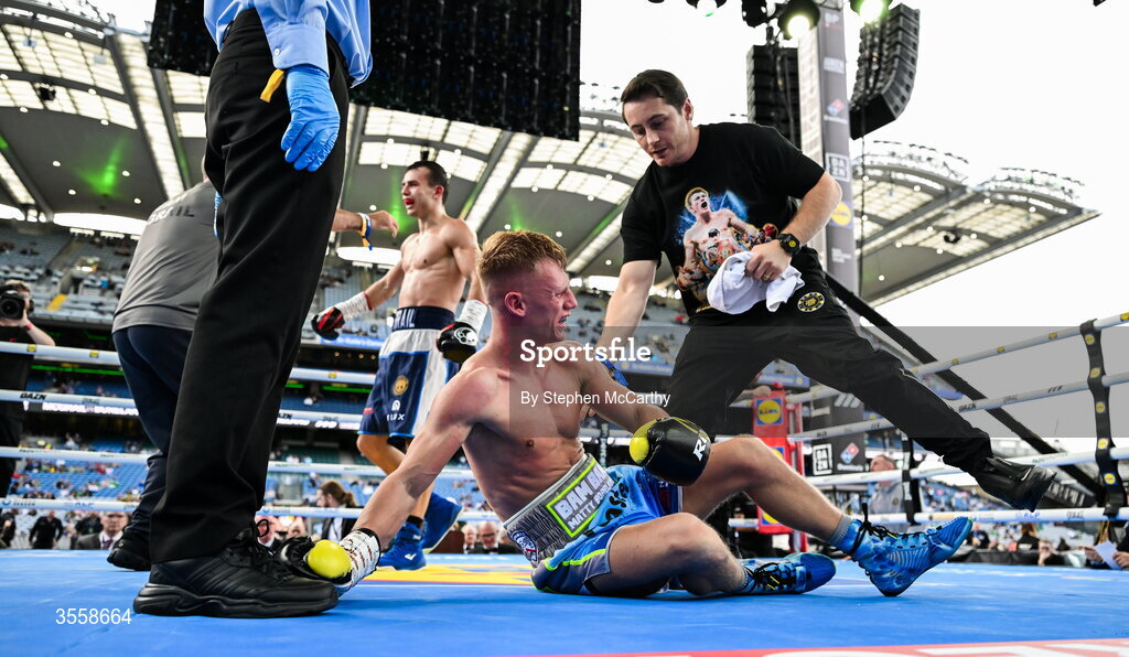 5 September 2026; Matthew Boreland, left, with his trainer Ryan Burnett after being knocked down during his WBA continental gold super bantamweight bout with Joe McGrail at the Once Upon A Time fight night in Croke Park, Dublin. Photo by Stephen McCarthy/Sportsfile
