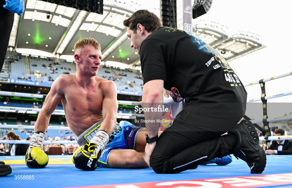 5 September 2026; Matthew Boreland, left, with his trainer Ryan Burnett after being knocked down during his WBA continental gold super bantamweight bout with Joe McGrail at the Once Upon A Time fight night in Croke Park, Dublin. Photo by Stephen McCarthy/Sportsfile