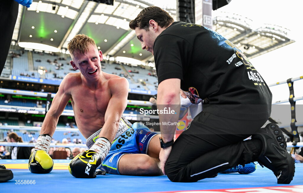 5 September 2026; Matthew Boreland, left, with his trainer Ryan Burnett after being knocked down during his WBA continental gold super bantamweight bout with Joe McGrail at the Once Upon A Time fight night in Croke Park, Dublin. Photo by Stephen McCarthy/Sportsfile