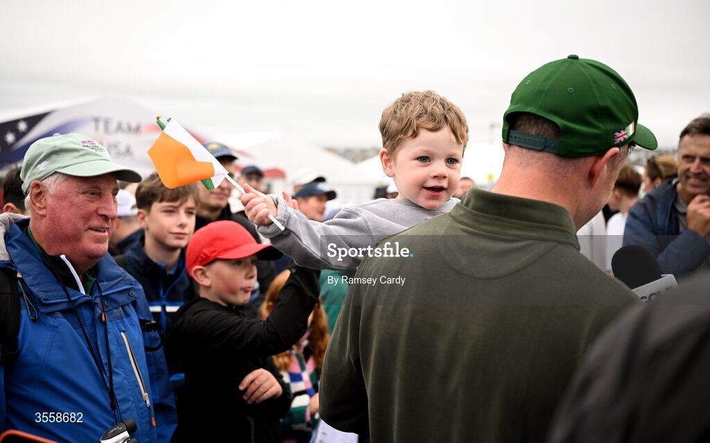 5 September 2026; Stuart Grehan of Great Britain and Ireland is interviewed with his son Kai after the singles matches on day one of the 51st Walker Cup at Lahinch Golf Club in Lahinch, Clare. Photo by Ramsey Cardy/Sportsfile