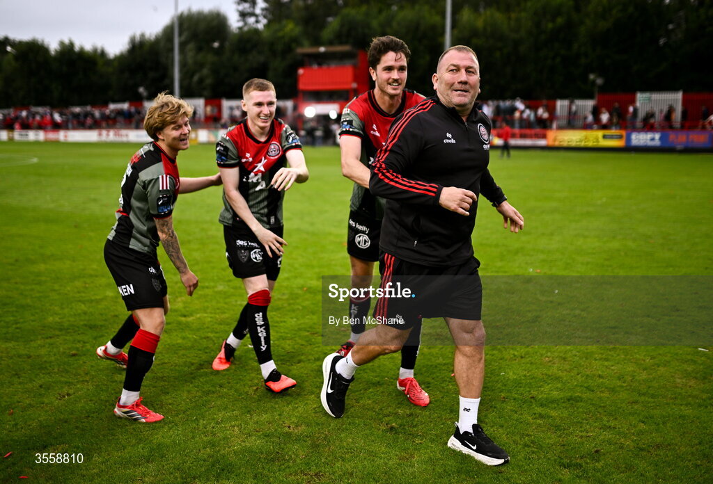 5 September 2026; Bohemians players, from left, Harry Vaughan, Ross Tierney and Patrick Hickey push Bohemians manager Alan Reynolds to celebrate toward the Bohemians supporters after the Club Orange Men’s FAI Cup quarter-final match between St Patrick's Athletic and Bohemians at Richmond Park in Dublin. Photo by Ben McShane/Sportsfile