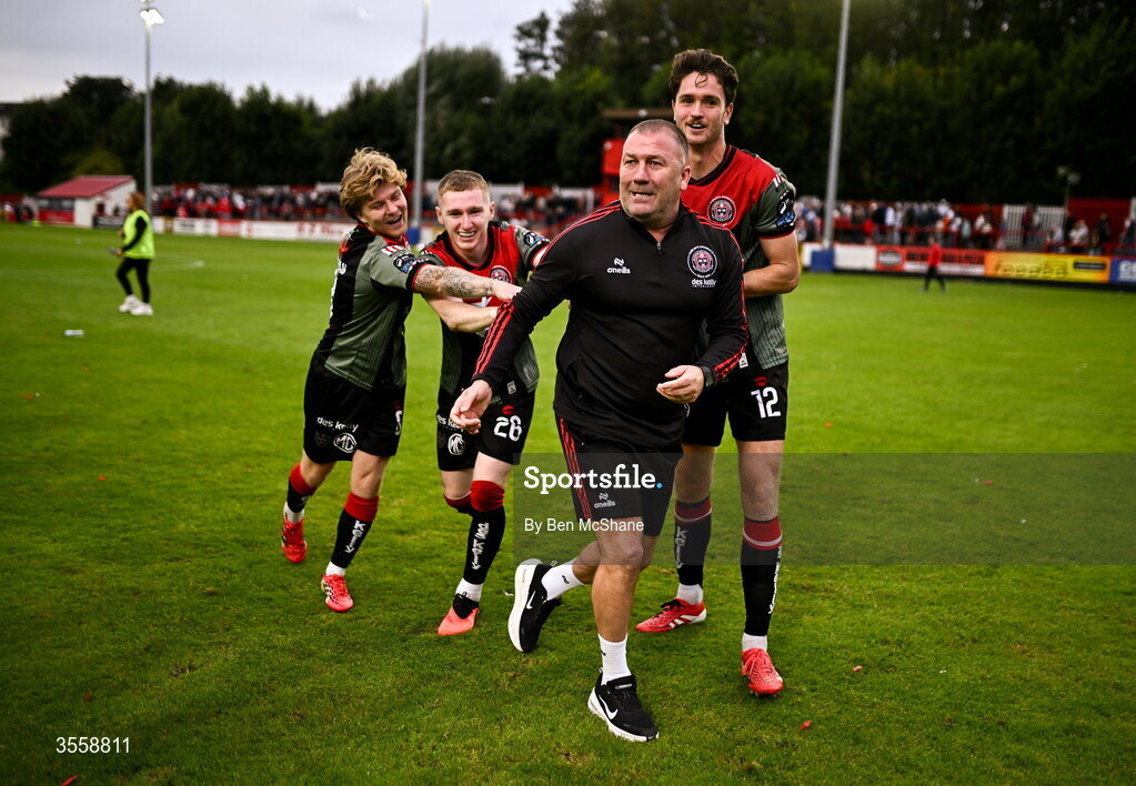 5 September 2026; Bohemians players, from left, Harry Vaughan, Ross Tierney and Patrick Hickey push Bohemians manager Alan Reynolds to celebrate toward the Bohemians supporters after the Club Orange Men’s FAI Cup quarter-final match between St Patrick's Athletic and Bohemians at Richmond Park in Dublin. Photo by Ben McShane/Sportsfile