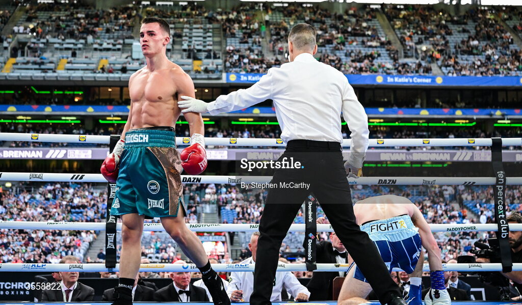 5 September 2026; Taylor Bevan, left, reacts after knocking down Emmet Brennan during their super middleweight bout at the Once Upon A Time fight night in Croke Park, Dublin. Photo by Stephen McCarthy/Sportsfile