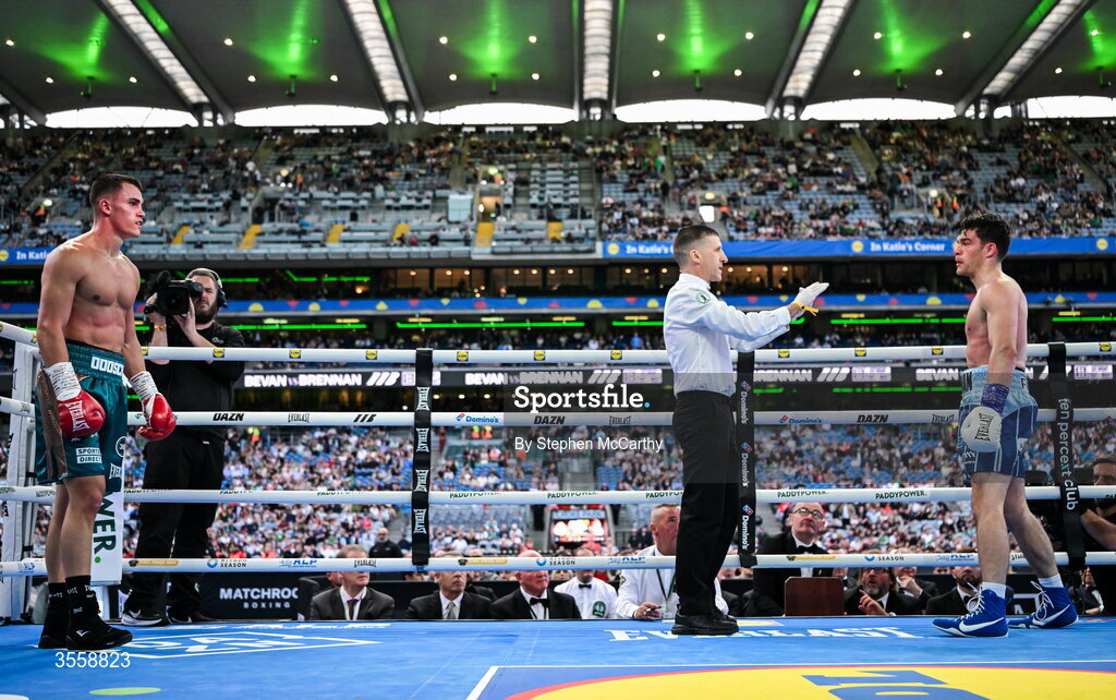 5 September 2026; Taylor Bevan, left, reacts after knocking down Emmet Brennan during their super middleweight bout at the Once Upon A Time fight night in Croke Park, Dublin. Photo by Stephen McCarthy/Sportsfile