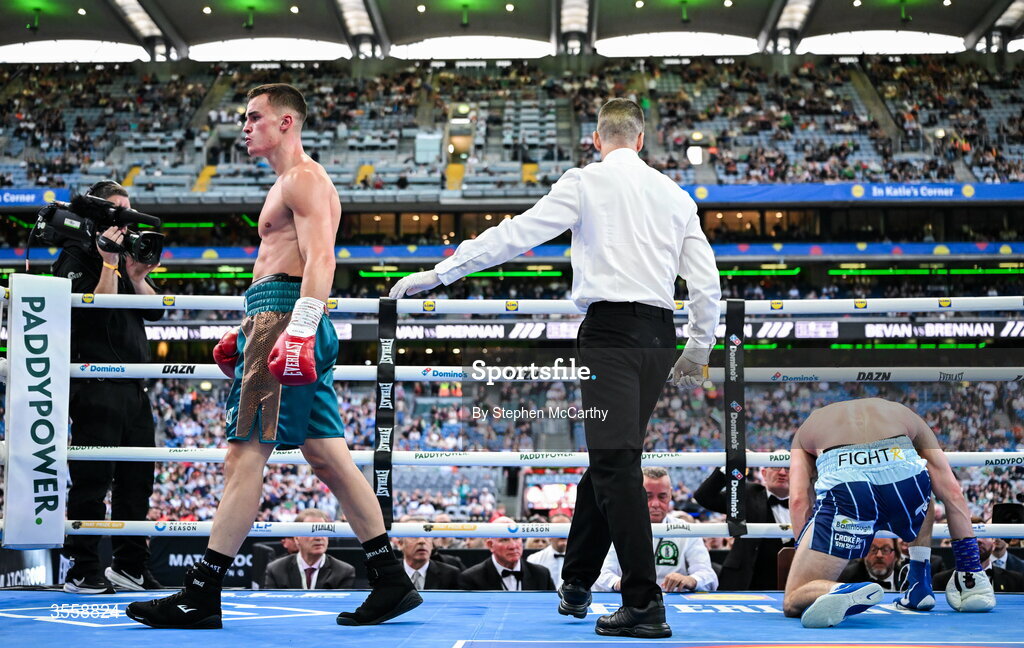 5 September 2026; Taylor Bevan, left, reacts after knocking down Emmet Brennan during their super middleweight bout at the Once Upon A Time fight night in Croke Park, Dublin. Photo by Stephen McCarthy/Sportsfile
