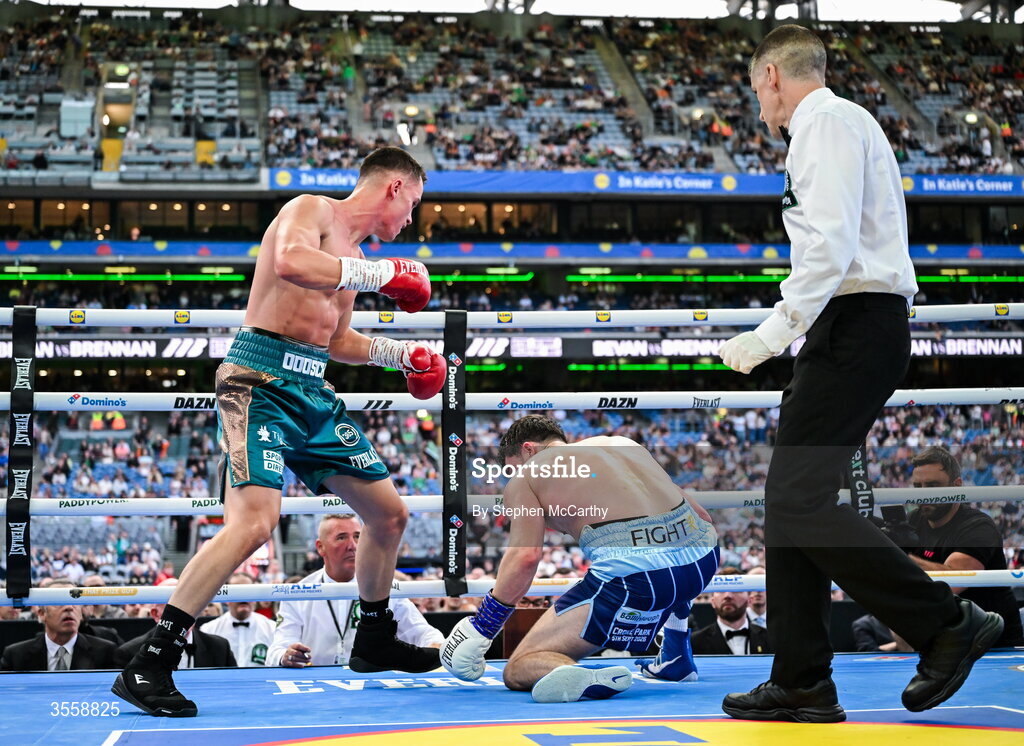 5 September 2026; Taylor Bevan, left, knocks down Emmet Brennan during their super middleweight bout at the Once Upon A Time fight night in Croke Park, Dublin. Photo by Stephen McCarthy/Sportsfile
