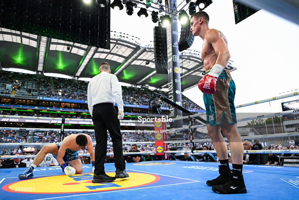 5 September 2026; Taylor Bevan, right, reacts after knocking down Emmet Brennan during their super middleweight bout at the Once Upon A Time fight night in Croke Park, Dublin. Photo by Stephen McCarthy/Sportsfile
