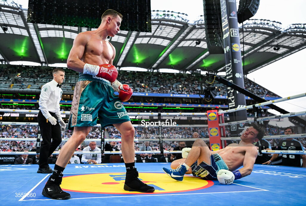5 September 2026; Taylor Bevan, left, knocks down Emmet Brennan during their super middleweight bout at the Once Upon A Time fight night in Croke Park, Dublin. Photo by Stephen McCarthy/Sportsfile