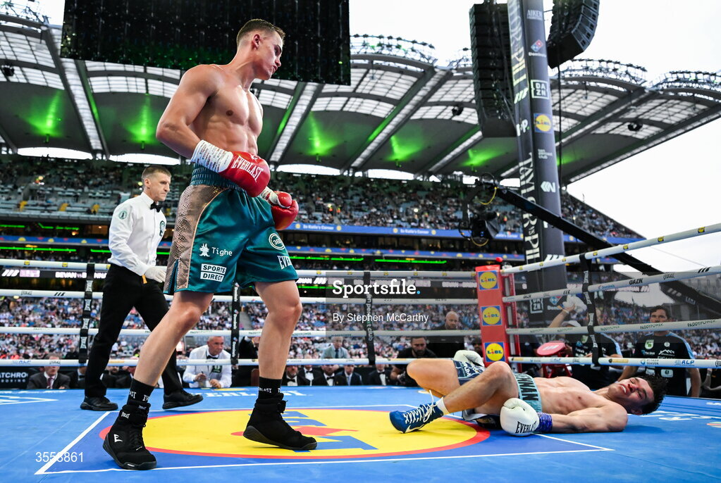 5 September 2026; Taylor Bevan, left, knocks down Emmet Brennan during their super middleweight bout at the Once Upon A Time fight night in Croke Park, Dublin. Photo by Stephen McCarthy/Sportsfile