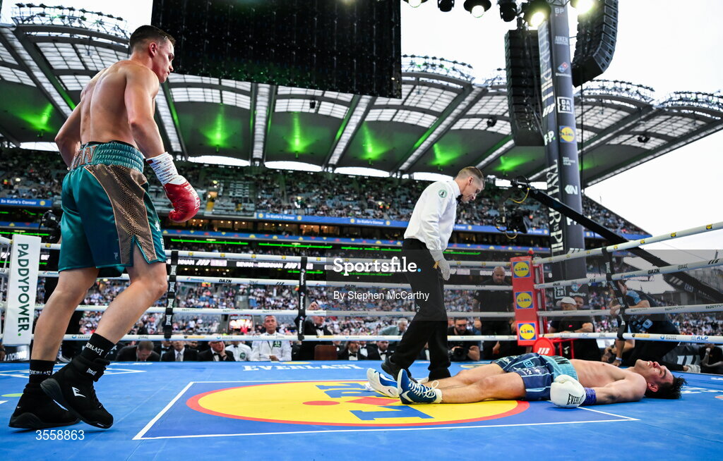 5 September 2026; Taylor Bevan, left, knocks down Emmet Brennan during their super middleweight bout at the Once Upon A Time fight night in Croke Park, Dublin. Photo by Stephen McCarthy/Sportsfile