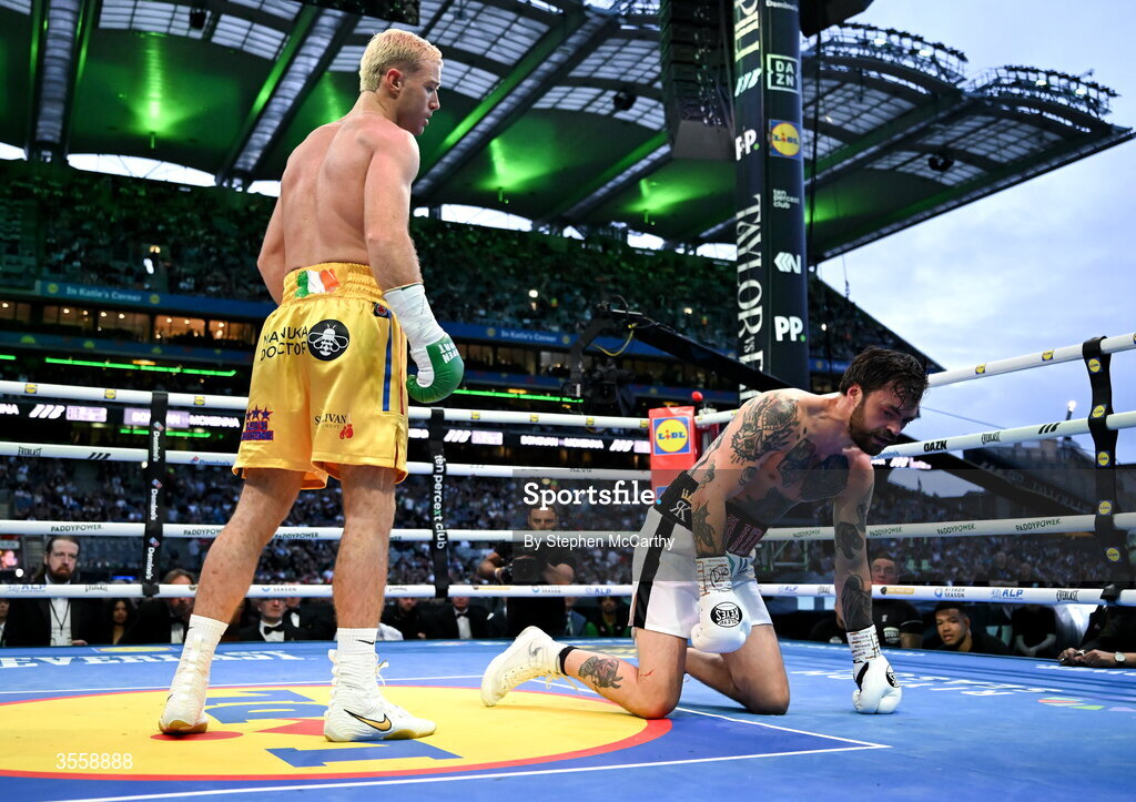 5 September 2026; Paddy Donovan, left, knocks down Tyrone McKenna during their welterweight bout at the Once Upon A Time fight night in Croke Park, Dublin. Photo by Stephen McCarthy/Sportsfile