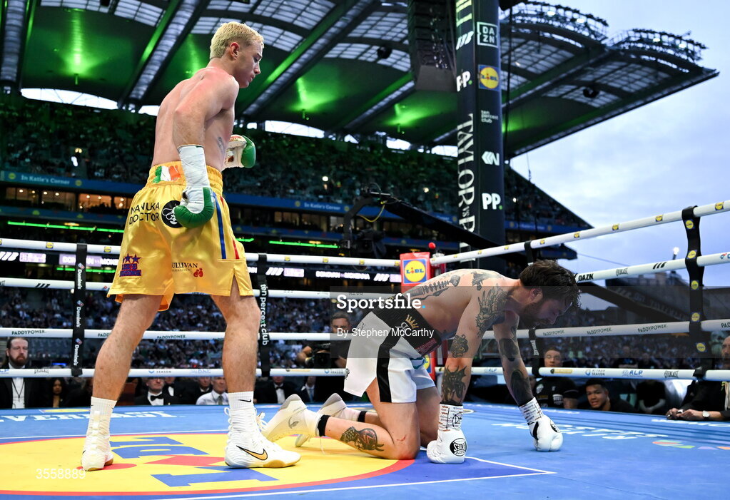 5 September 2026; Paddy Donovan, left, knocks down Tyrone McKenna during their welterweight bout at the Once Upon A Time fight night in Croke Park, Dublin. Photo by Stephen McCarthy/Sportsfile
