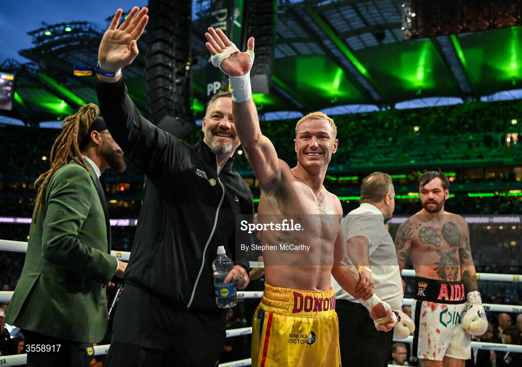 5 September 2026; Paddy Donovan, centre, celebrates with his trainer Andy Lee after being declared victorious in his welterweight bout with Tyrone McKenna at the Once Upon A Time fight night in Croke Park, Dublin. Photo by Stephen McCarthy/Sportsfile